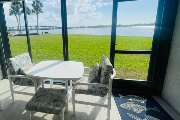 a view of a balcony with chairs