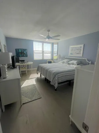 a bedroom with a bed and a couch