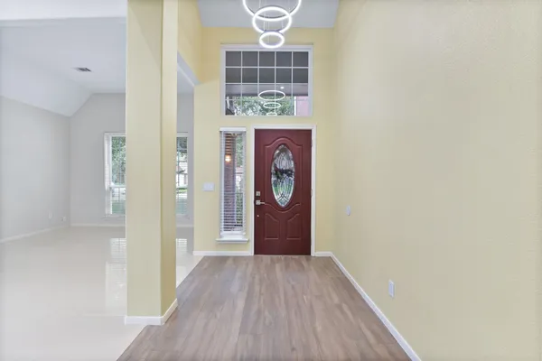 a view of entryway with wooden floor