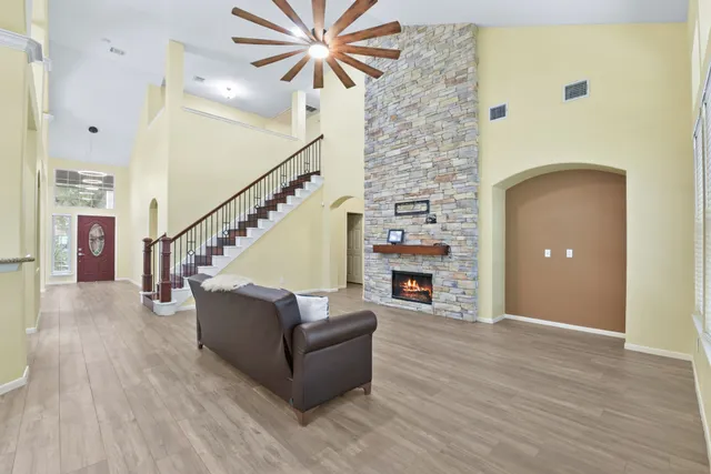 a living room with furniture and a fireplace