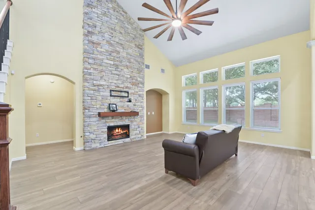a living room with furniture and a fireplace