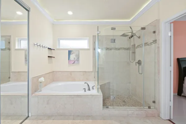 a bathroom with a bathtub and a shower