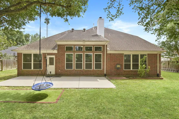 a front view of a house with a yard and porch