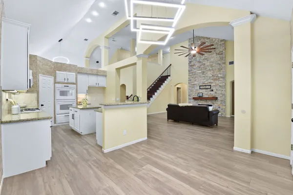 a view of kitchen with furniture and wooden floor