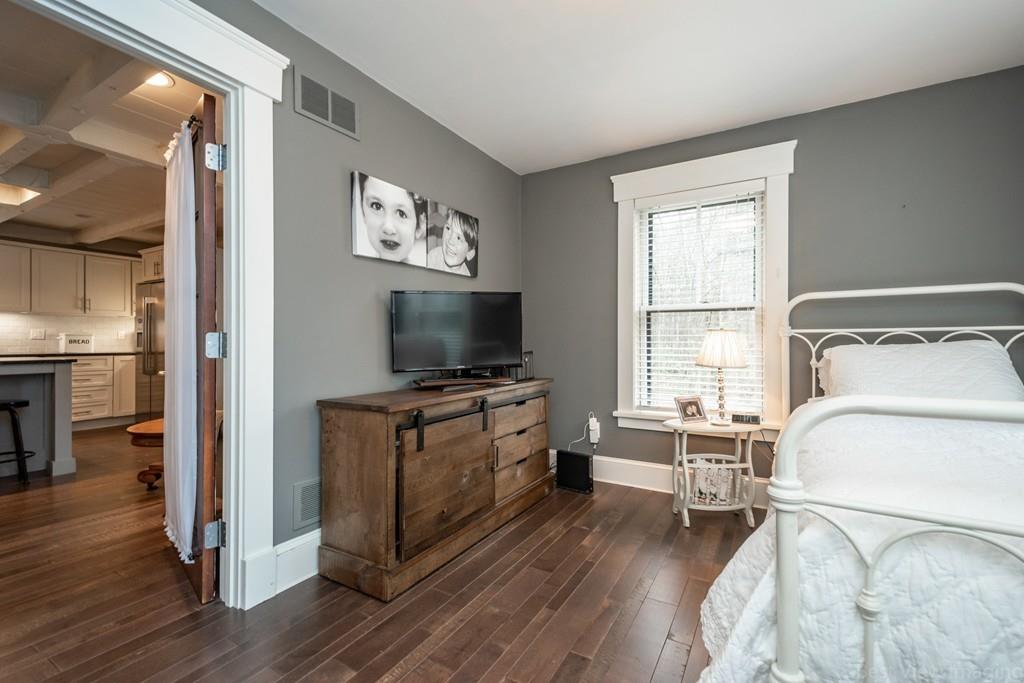 25 Crockett Road Upton, MA 01568 - Photo 22 of 39 a living room with furniture and a flat screen tv