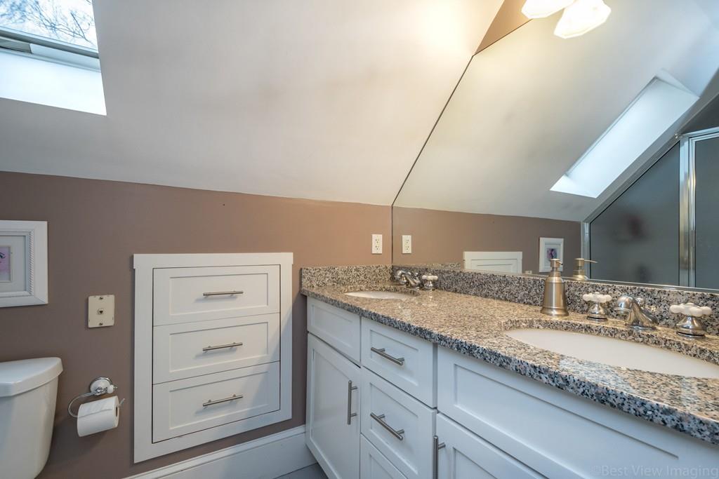 25 Crockett Road Upton, MA 01568 - Photo 28 of 39 a bathroom with a granite countertop sink mirror vanity and toilet