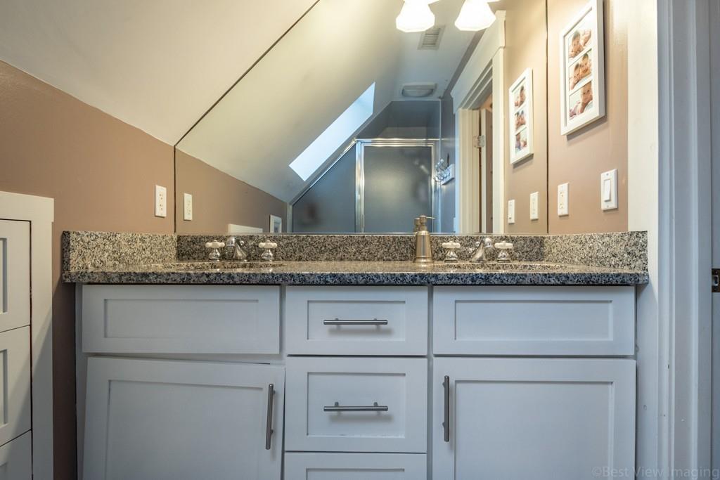 25 Crockett Road Upton, MA 01568 - Photo 29 of 39 a bathroom with a granite countertop sink and a mirror