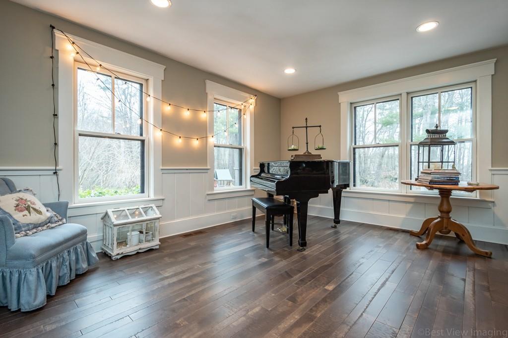25 Crockett Road Upton, MA 01568 - Photo 6 of 39 a living room with furniture and a wooden floor next to a window