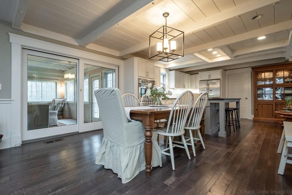 25 Crockett Road Upton, MA 01568 - Photo 8 of 39 a view of a dining room with furniture wooden floor and chandelier