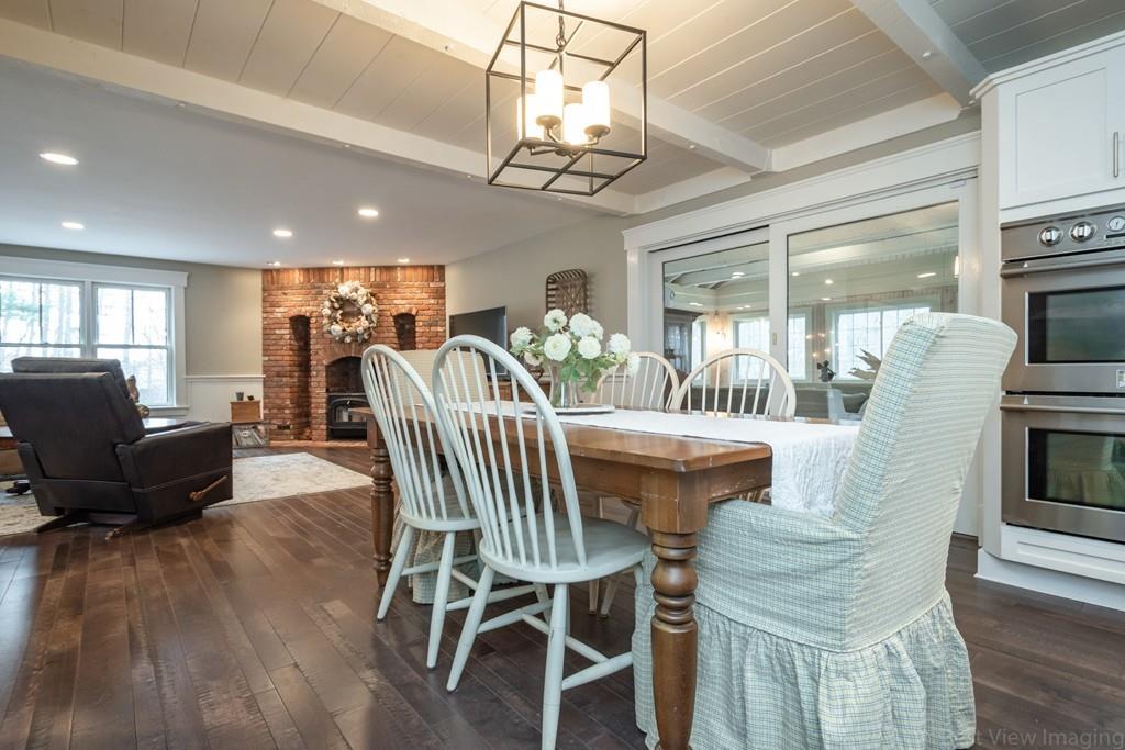 25 Crockett Road Upton, MA 01568 - Photo 10 of 39 a view of a dining room with furniture wooden floor and chandelier