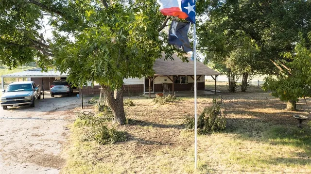 an aerial view of residential house with outdoor space