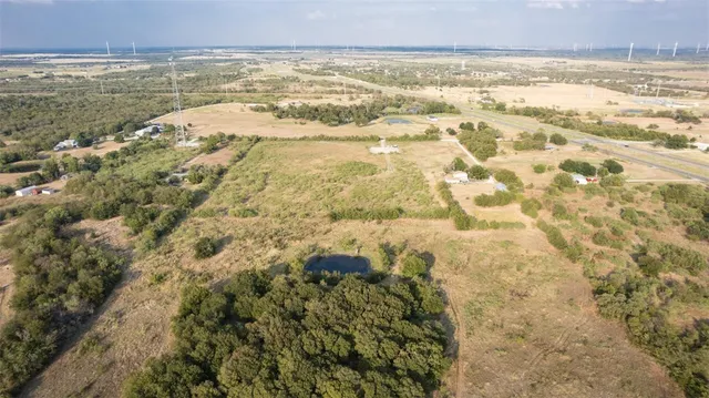 a view of a backyard of the house