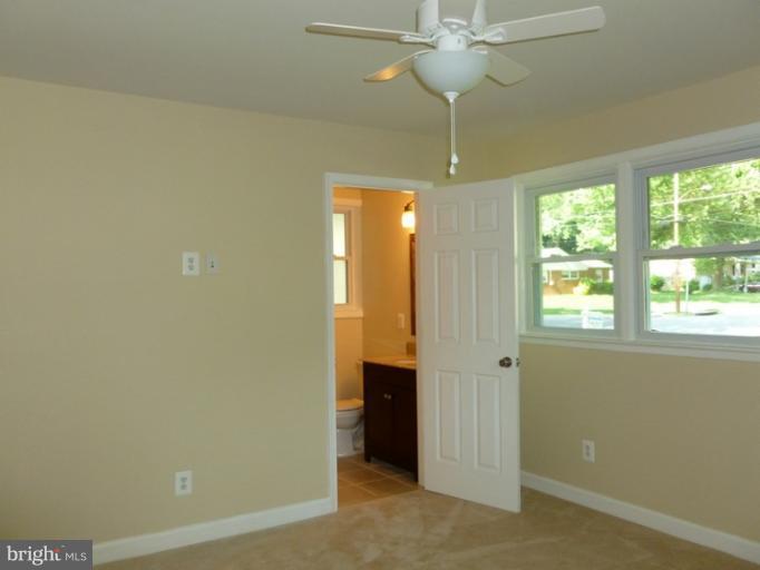5209 Kipling Street Springfield, VA 22151 - Photo 8 of 29 a view of a chandelier fan and entryway
