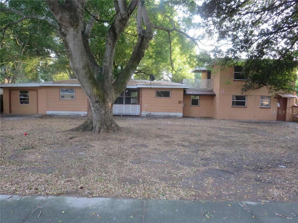 419 Stremma Road Largo, FL 33770 - Photo 1 of 1 a house that has a tree in front of it