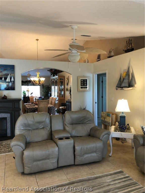 1208 Lakeside Way Sebring, FL 33875 - Photo 19 of 29 a living room with furniture and a lamp