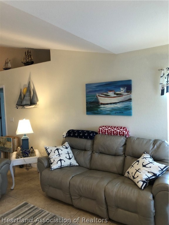1208 Lakeside Way Sebring, FL 33875 - Photo 20 of 29 a living room with furniture and a couch