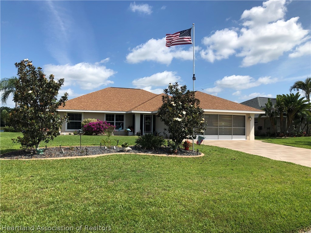 1208 Lakeside Way Sebring, FL 33875 - Photo 2 of 29 a view of house with outdoor space and porch