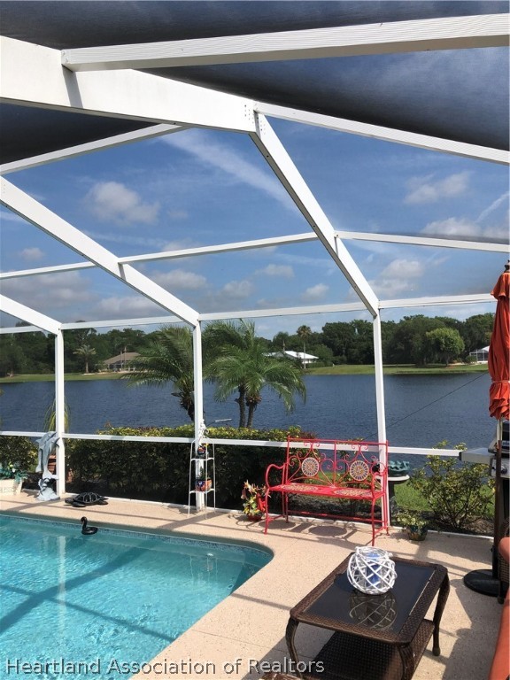 1208 Lakeside Way Sebring, FL 33875 - Photo 23 of 29 a view of a patio with table and chairs potted plants with wooden floor