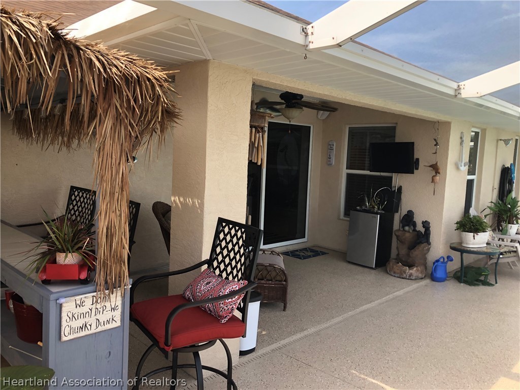 1208 Lakeside Way Sebring, FL 33875 - Photo 25 of 29 a view of outdoor space with seating area