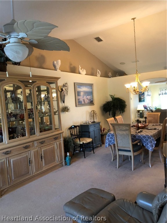 1208 Lakeside Way Sebring, FL 33875 - Photo 3 of 29 a living room with furniture a window and kitchen view