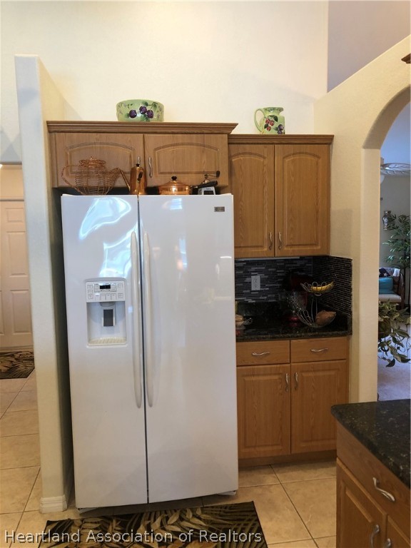 1208 Lakeside Way Sebring, FL 33875 - Photo 5 of 29 a white refrigerator freezer sitting inside of a kitchen