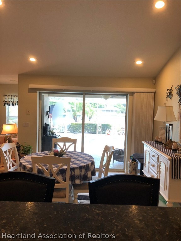 1208 Lakeside Way Sebring, FL 33875 - Photo 7 of 29 a living room with furniture large window and a table