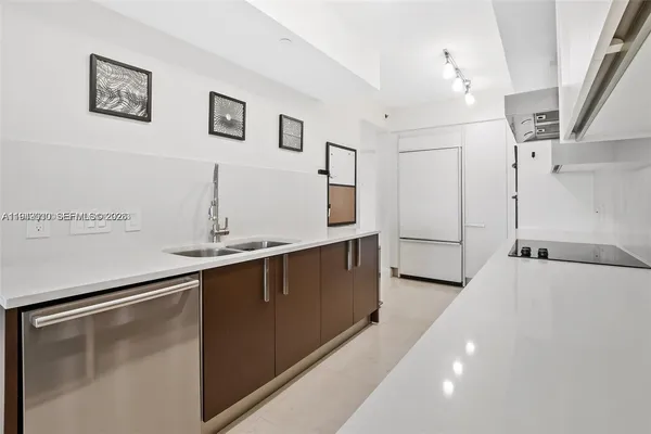 a kitchen with a sink and cabinets