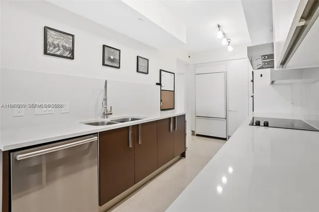 a kitchen with a sink and cabinets