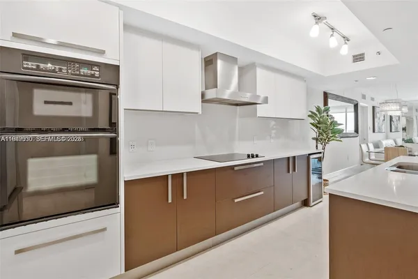 a kitchen with stainless steel appliances granite countertop a stove and a sink