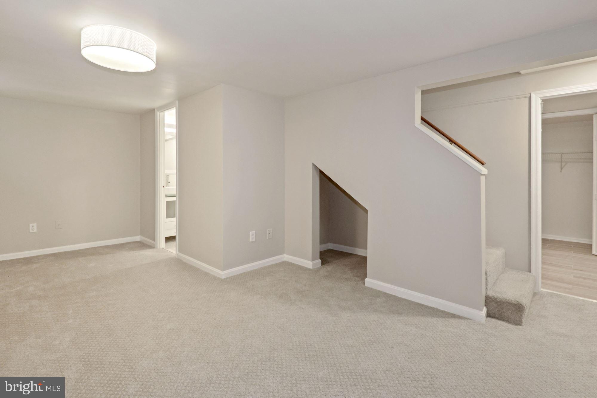 4724 River Road Bethesda, MD 20816 - Photo 26 of 42 Fun storage/carpeted nook under stairs
