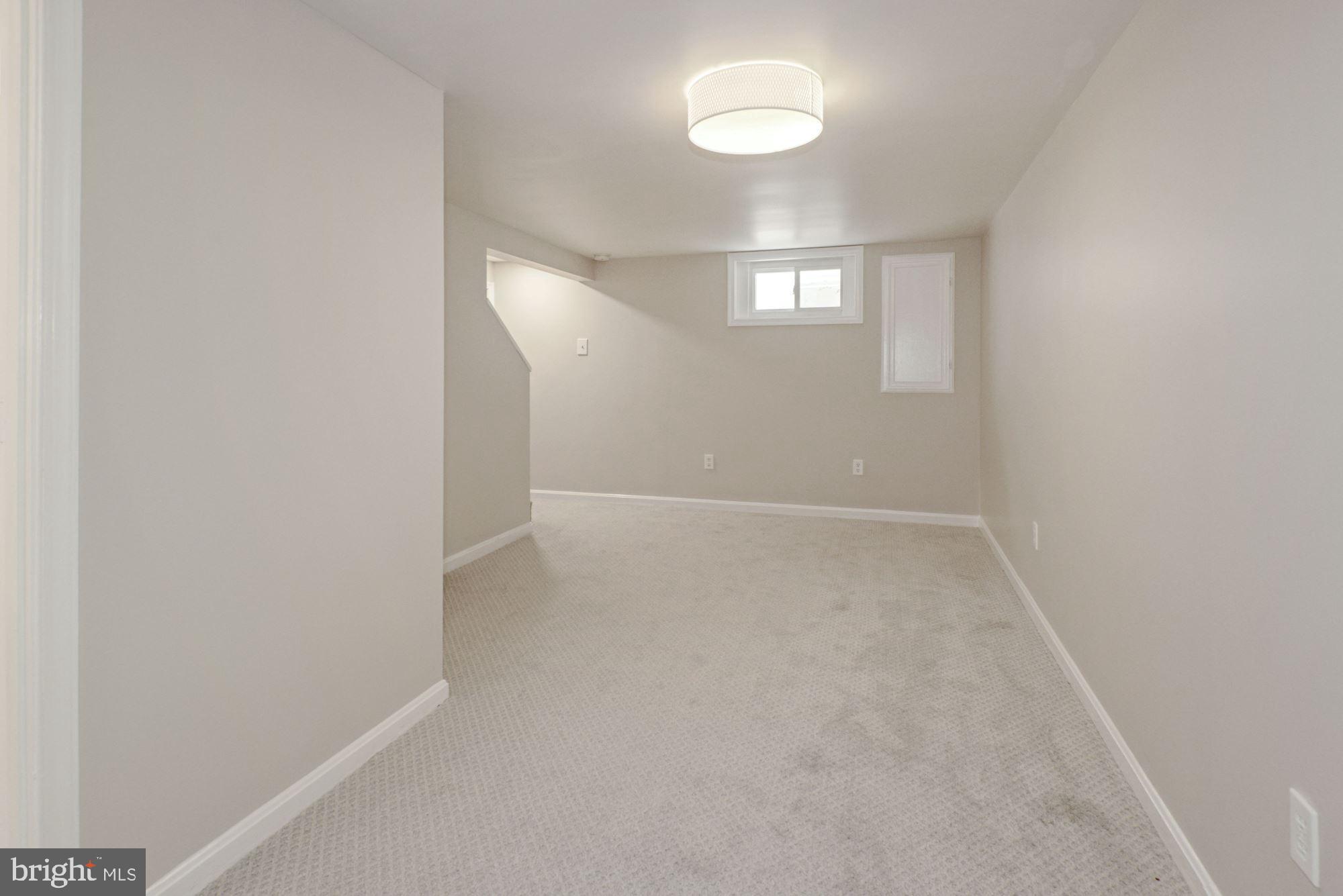 4724 River Road Bethesda, MD 20816 - Photo 27 of 42 Spacious Rec Room with 2 ceiling height windows
