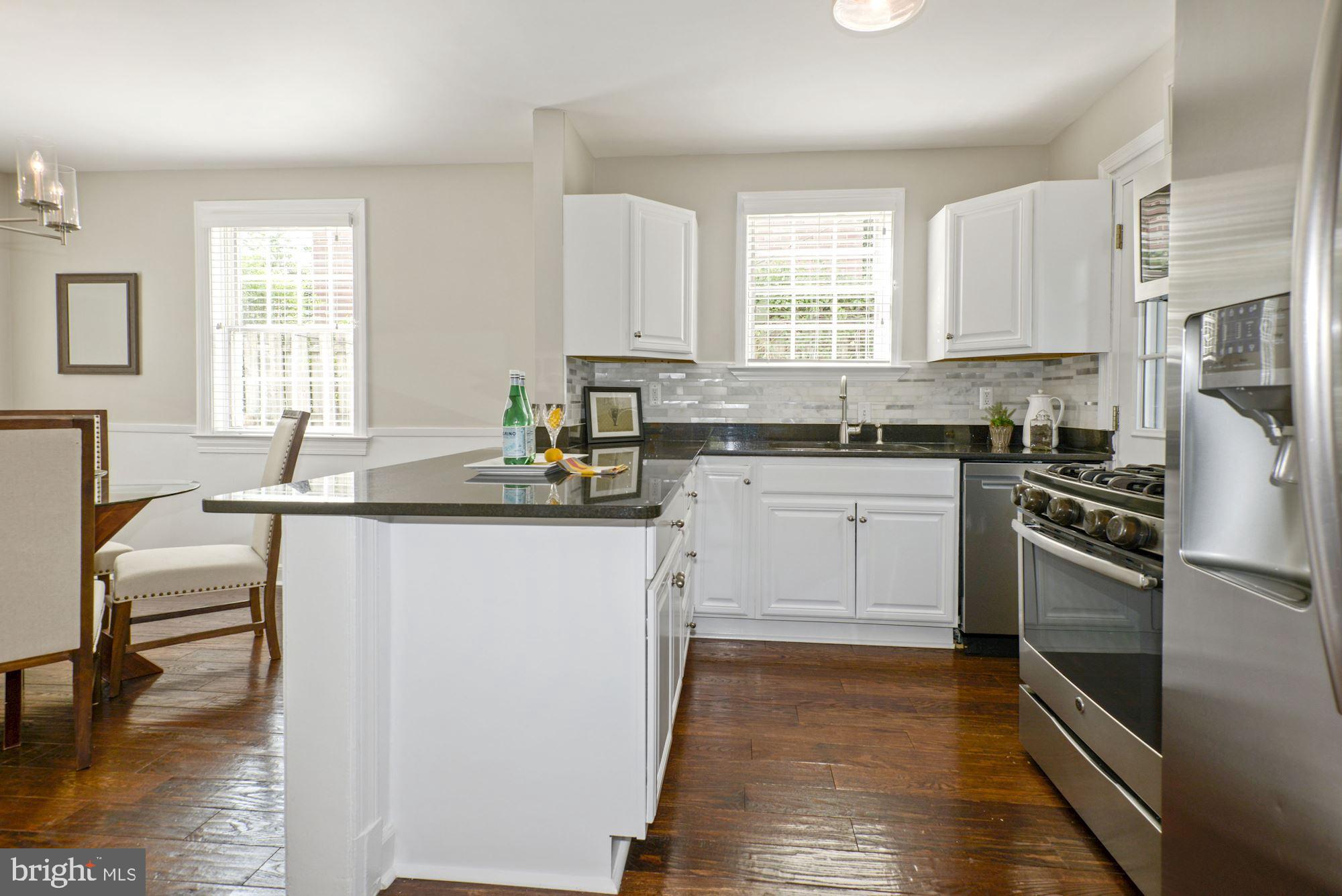 4724 River Road Bethesda, MD 20816 - Photo 8 of 42 Breakfast Bar, loads of cabinets, door to patio