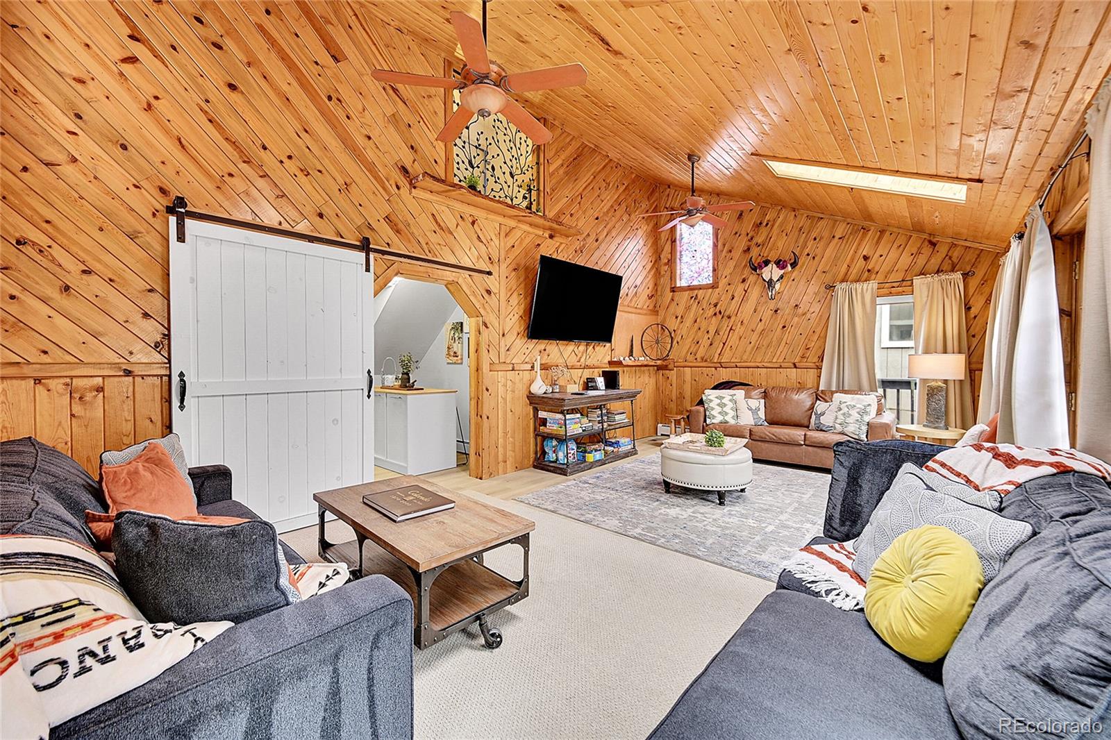 3645 Stanley Road Dumont, CO 80436 - Photo 13 of 40 a living room with furniture and a flat screen tv