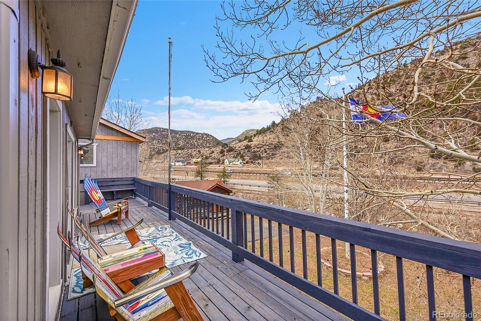 3645 Stanley Road Dumont, CO 80436 - Photo 26 of 39 a balcony with wooden floor and trees