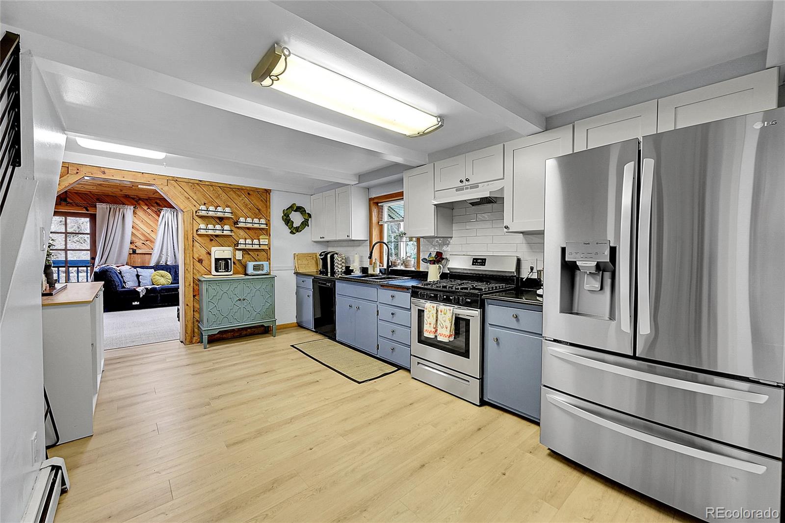 3645 Stanley Road Dumont, CO 80436 - Photo 5 of 40 a kitchen with granite countertop stainless steel appliances and wooden cabinets