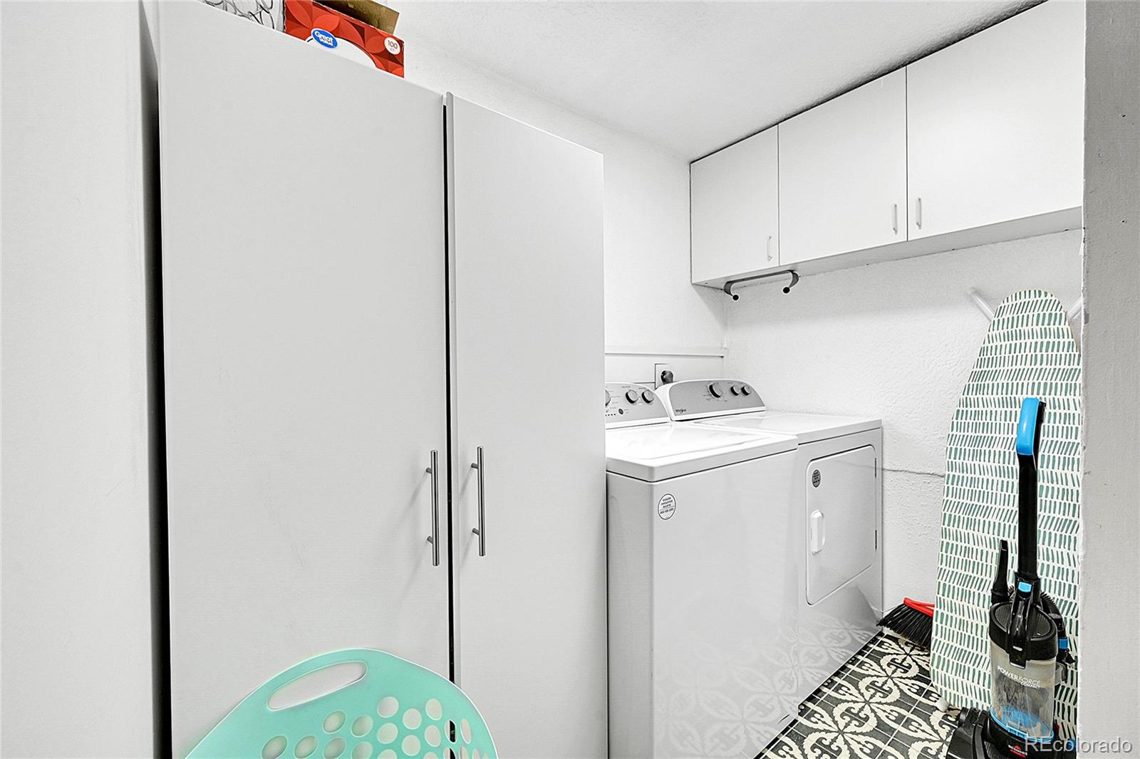 3645 Stanley Road Dumont, CO 80436 - Photo 7 of 39 a utility room with cabinets washer and dryer