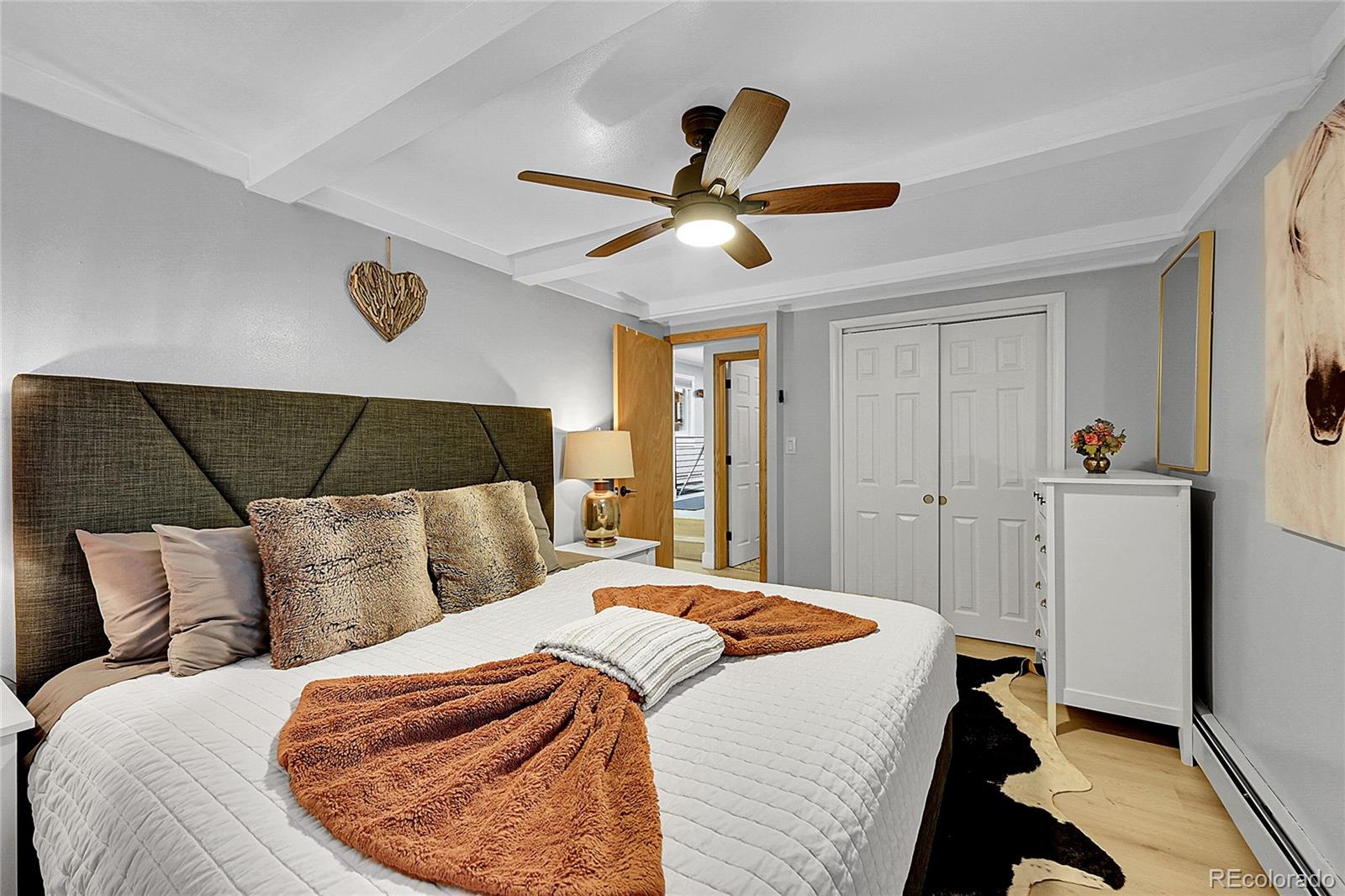 3645 Stanley Road Dumont, CO 80436 - Photo 10 of 40 a bedroom with a bed and wooden floor