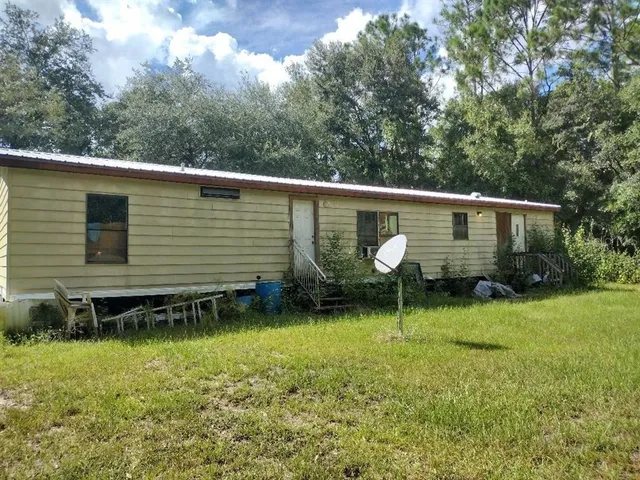 a view of backyard with green space