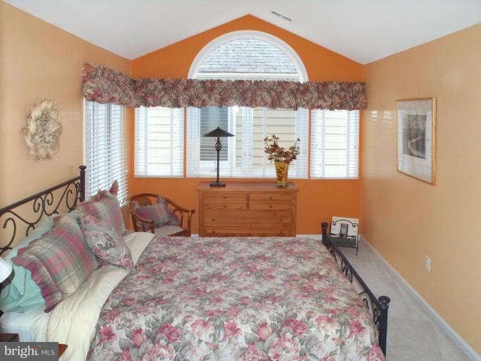 11200 Center Post Court Reston, VA 20194 - Photo 13 of 30 a bedroom with a bed and a window
