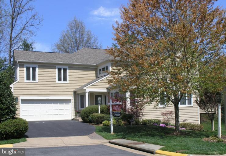 11200 Center Post Court Reston, VA 20194 - Photo 3 of 30 a front view of a house with yard and green space