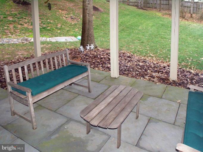 11200 Center Post Court Reston, VA 20194 - Photo 24 of 30 a wooden bench sitting in front of a building