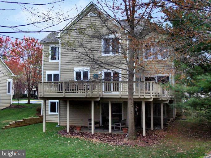 11200 Center Post Court Reston, VA 20194 - Photo 4 of 30 a front view of a house with a garden