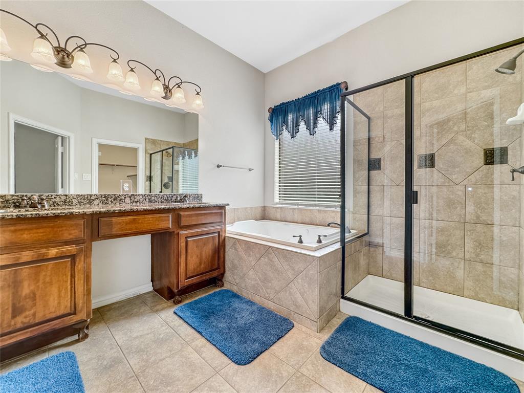 401 Varnum Way Fairview, TX 75069 - Photo 18 of 33 a large bathroom with a granite countertop double vanity sink and a mirror