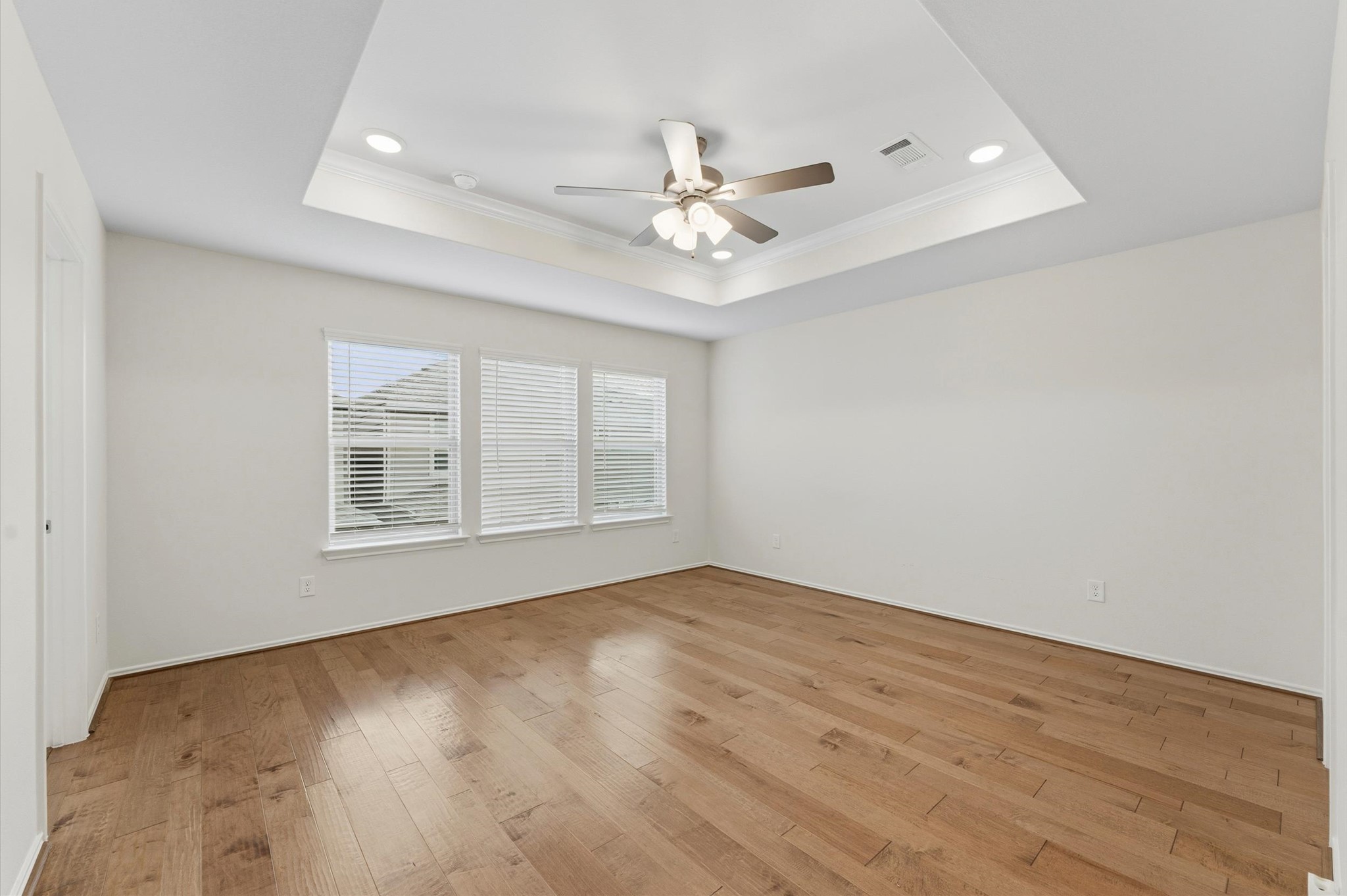 1822 Calabasas Way Houston, TX 77080 - Photo 15 of 32 wooden floor in an empty room with a window