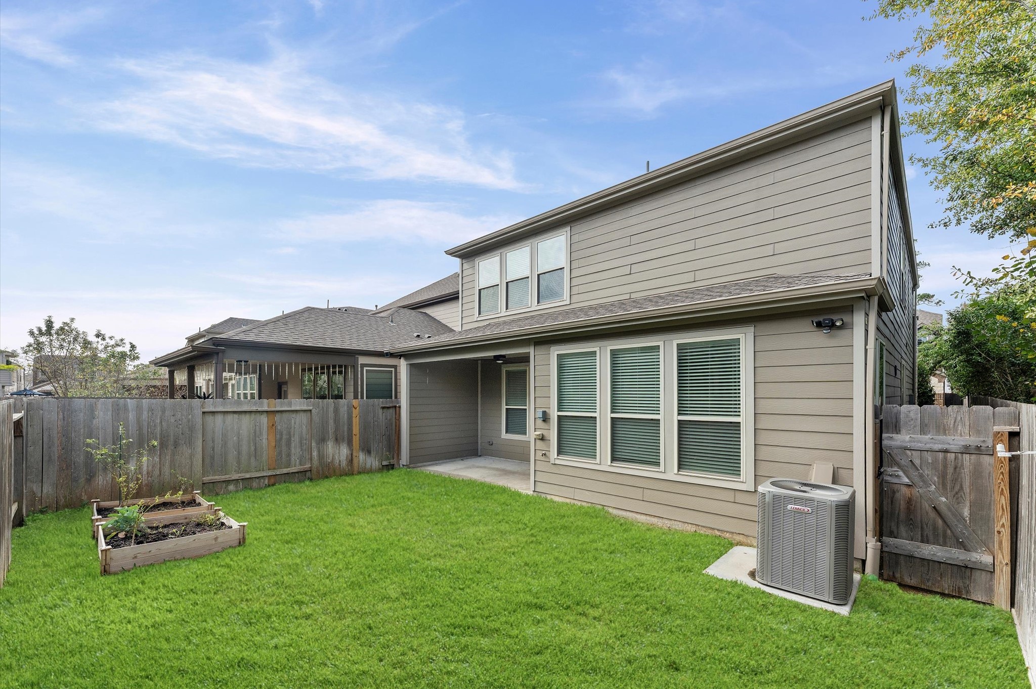1822 Calabasas Way Houston, TX 77080 - Photo 27 of 32 a front view of a house with a garden and yard