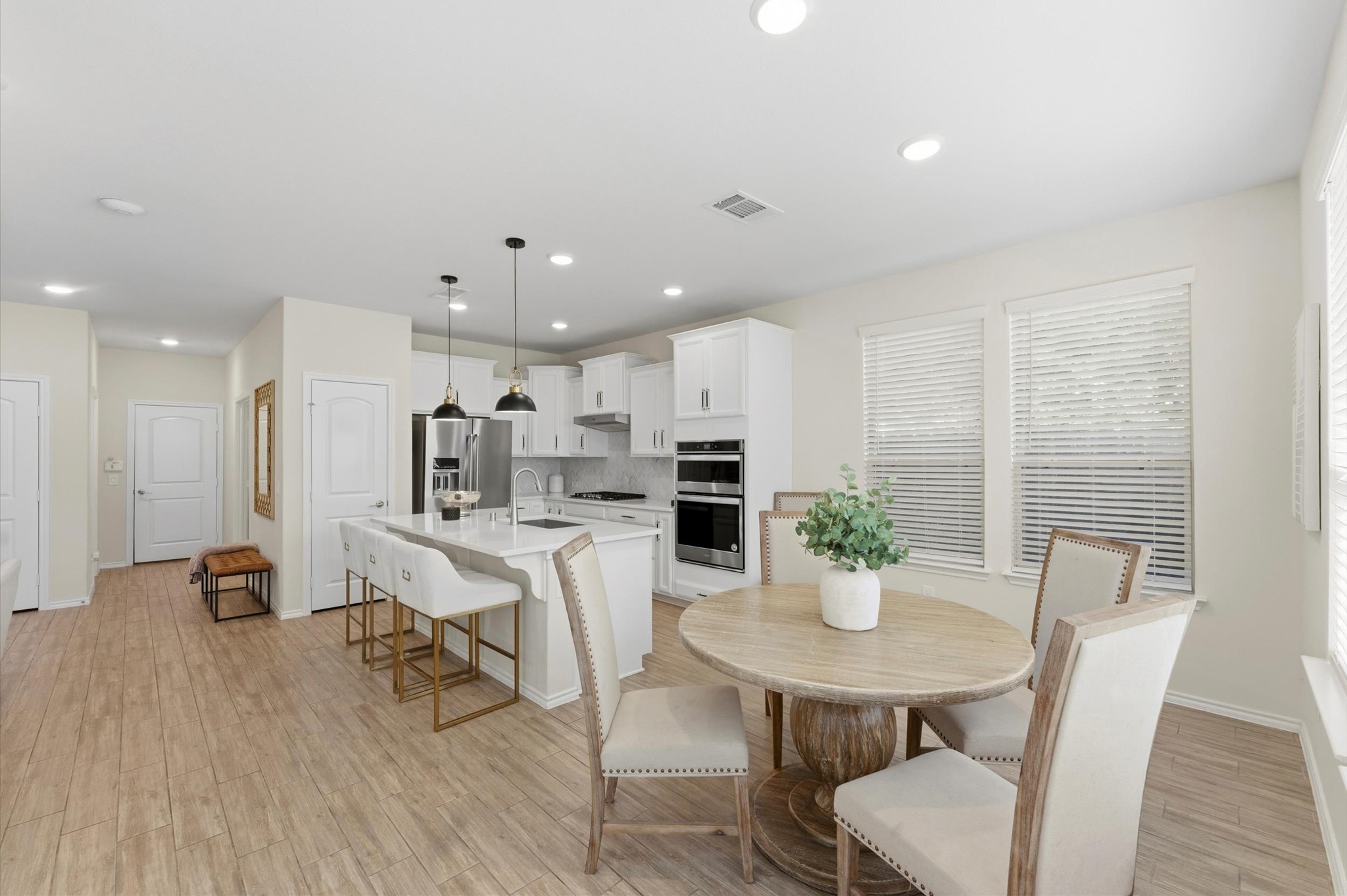 1822 Calabasas Way Houston, TX 77080 - Photo 10 of 32 a view of a dining room with furniture and wooden floor