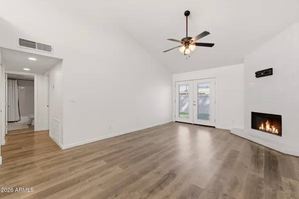 a kitchen with granite countertop a sink a stove and cabinets