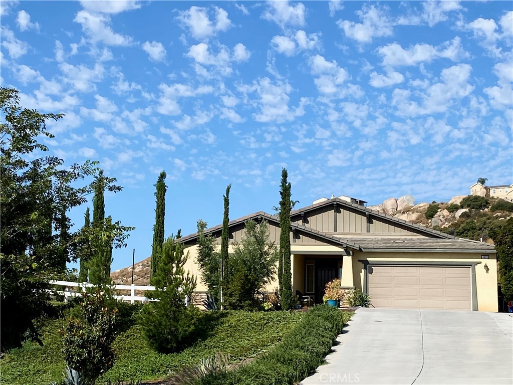 4420 Gilchrist Drive Riverside, CA 92505 - Photo 1 of 1 a view of a house with a yard and potted plants