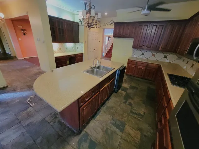 a spacious bathroom with a sink toilet and a mirror
