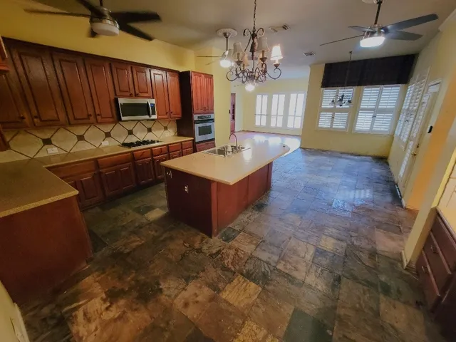 a kitchen with sink cabinets and window
